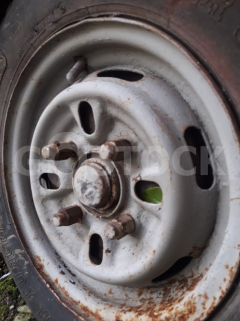 Old Rusted car rims or old car rusty wheel