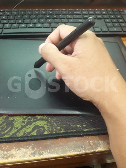Hand holding display pen