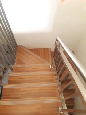Stair with stainless tail railing